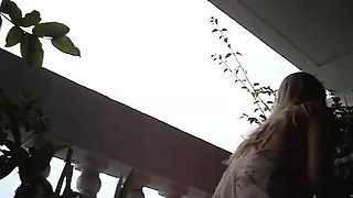 Super luxurious upskirt chick gets filmed at the balcony on the hidden camera